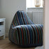 Mehrfarbiger Lounge Chair Paul Smith mit linearem Design und passendem Hocker auf hellem Boden | Lounge Chair Paul Smith - Limited Edition - | SACKit