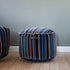 Mehrfarbiger Lounge Chair und Pouf Paul Smith mit linearem Design und Baumwollbezug.