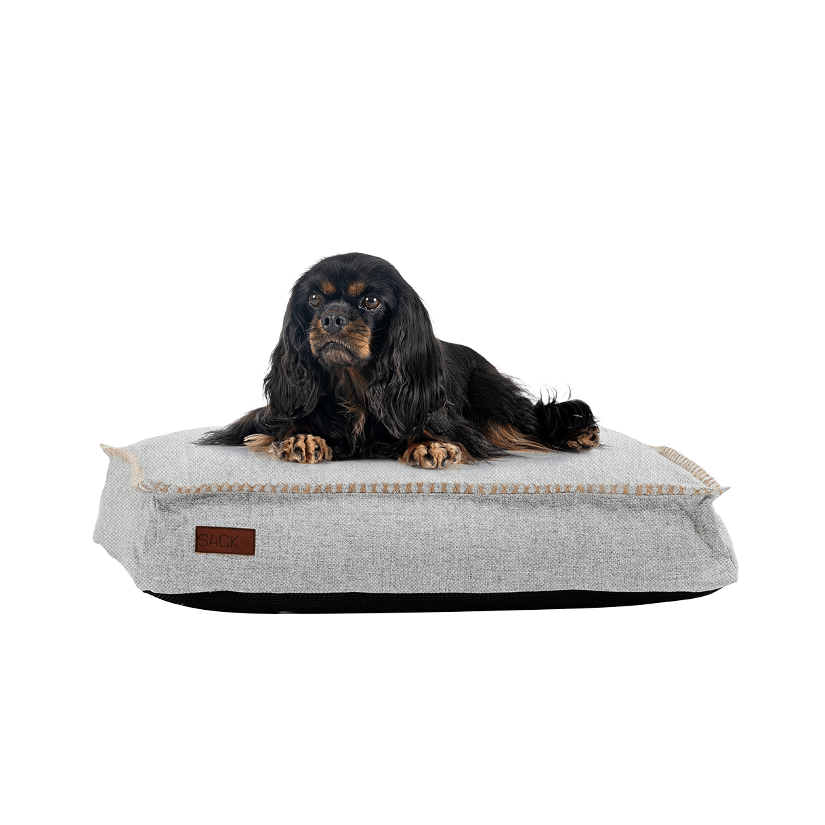 Cobana Dog bed in medium size with sand melange fabric and hand-stitched linen edges.