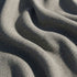 Nahaufnahme des strukturierten grauen Bezugsstoffs eines wetterfesten Outdoor Sofas von sackit mit weicher Haptik und skandinavischer Gestaltung