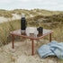 Mollis Coffee Table aus pulverbeschichtetem Aluminium mit getöntem Glas in Chestnut auf Terrasse | Mollis Coffee Table - Chestnut | SACKit