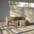 Beigefarbenes sackit Sofa im modularen Boneless Design mit weichen Polstern in einem hellen minimalistischen Innenraum mit warmem Schattenlicht