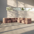 Braunes modulares Boneless Sofa mit weichen Kissen in einem hellen Innenraum, als großzügige Eckcouch mit flexibler Sitzanordnung.