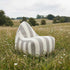 SACKit Chair Outdoor in Renesse Taupe mit runder Form und schwarzem Textilene-Boden.