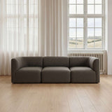 Dunkelgraues dreiteiliges Sofa von sackit in einem hellen skandinavischen Wohnzimmer mit hohen Fenstern und weichen Vorhängen | Fjord Sofa - Seat Section - Cosmo Mustard | SACKit