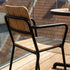 Schwarzer Kirra Patio Chair aus pulverbeschichtetem Aluminium und Teakholz auf Terrasse | Kirra Patio Chair - Black | SACKit
