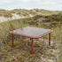 Mollis Coffee Table quadratisch in Chestnut mit pulverbeschichtetem Aluminiumrahmen und getöntem Glas, Outdoor - Setting | Mollis Coffee Table - Chestnut | SACKit